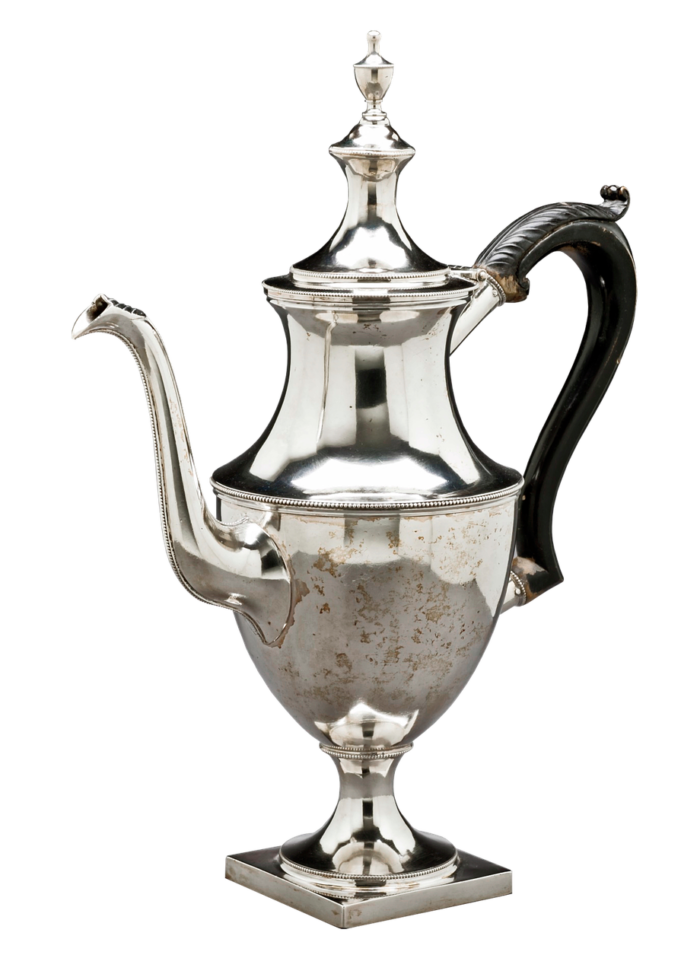 an antique silver coffee pot