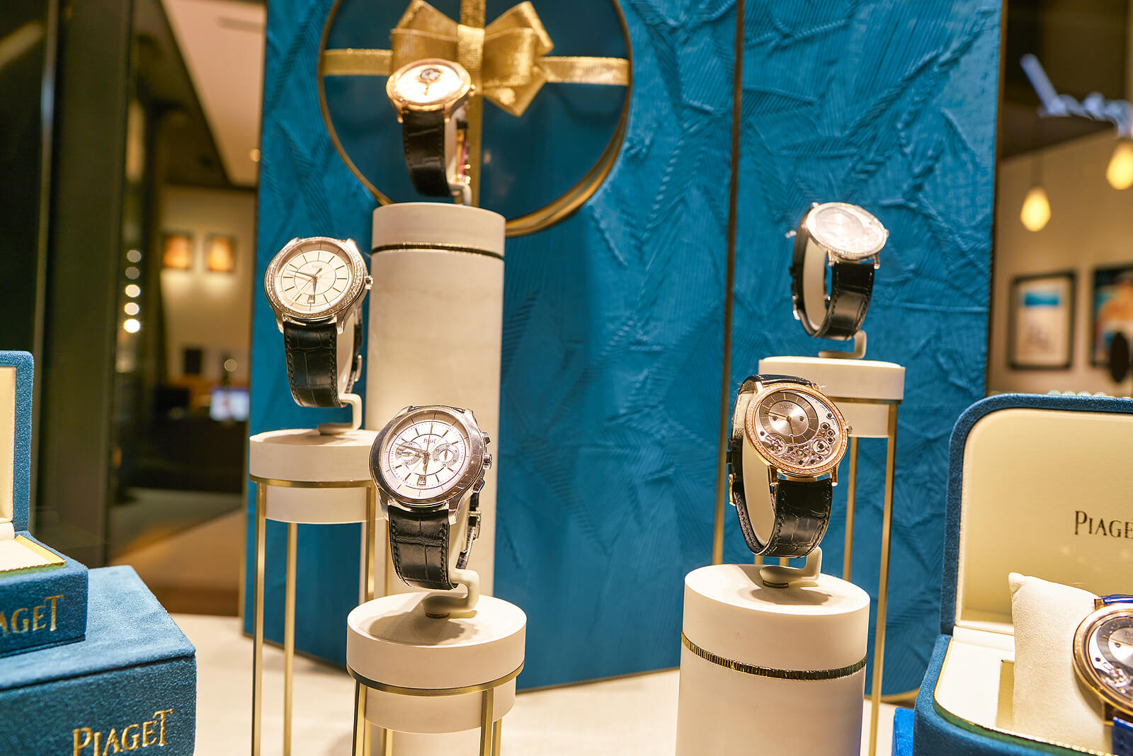 a selection of fine Piaget luxury watches on stands in a shopfront