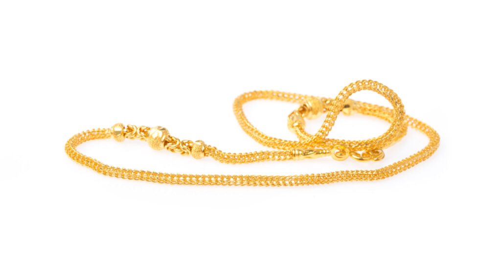 Golden necklace isolated on white background